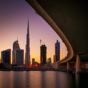 Reflection of tallest skyscrapers in Business Bay. Downtown summer day. Dubai, United Arab Emirates.